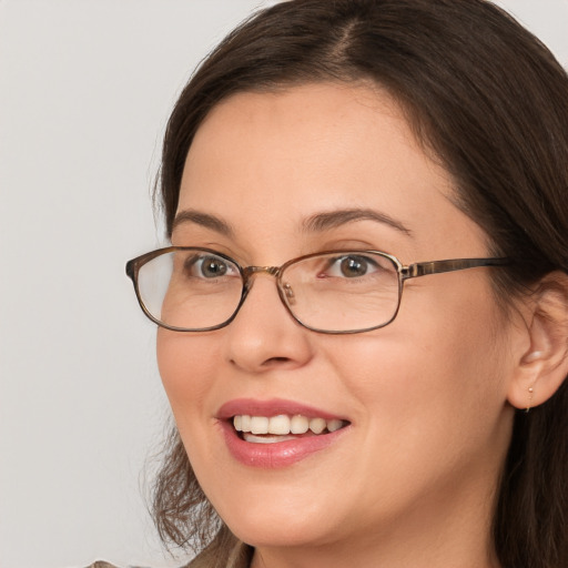 Joyful white adult female with medium  brown hair and brown eyes