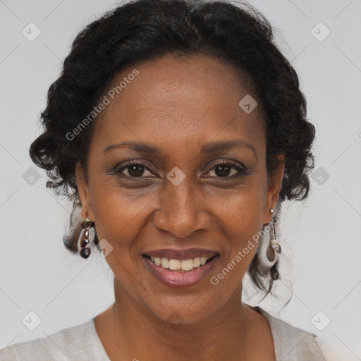 Joyful black adult female with medium  brown hair and brown eyes