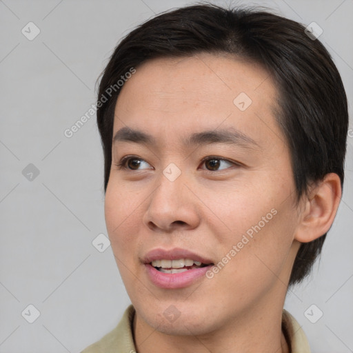Joyful asian young-adult male with short  brown hair and brown eyes
