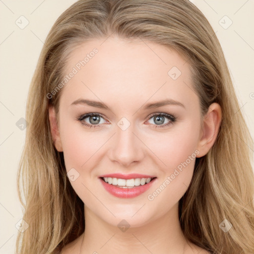 Joyful white young-adult female with long  brown hair and blue eyes