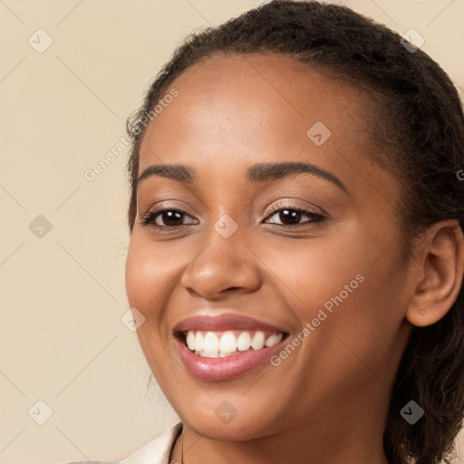 Joyful latino young-adult female with long  brown hair and brown eyes