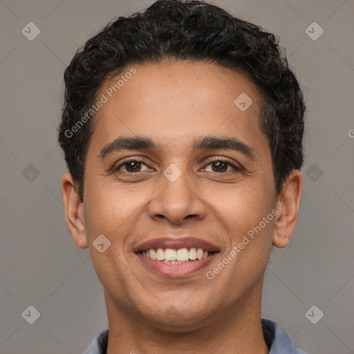 Joyful white young-adult male with short  black hair and brown eyes