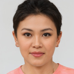 Joyful asian young-adult female with short  brown hair and brown eyes