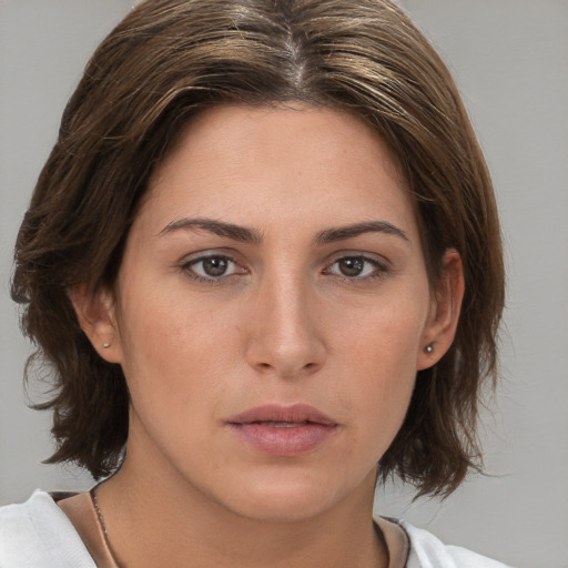 Neutral white young-adult female with medium  brown hair and brown eyes