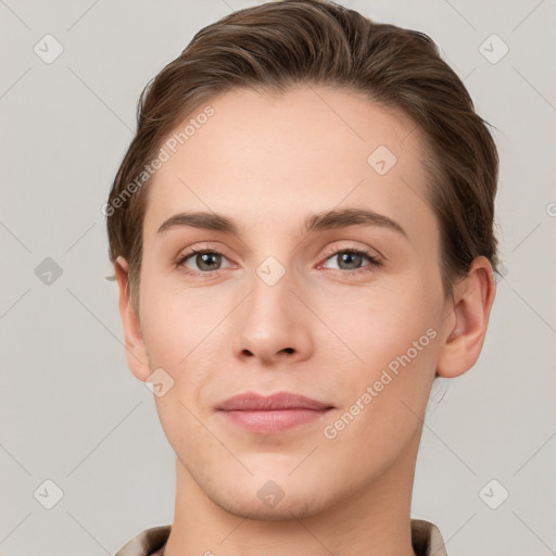 Joyful white young-adult female with short  brown hair and grey eyes