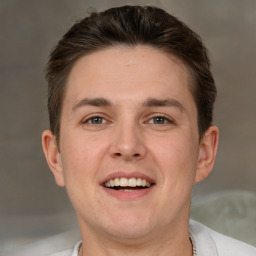 Joyful white adult male with short  brown hair and grey eyes