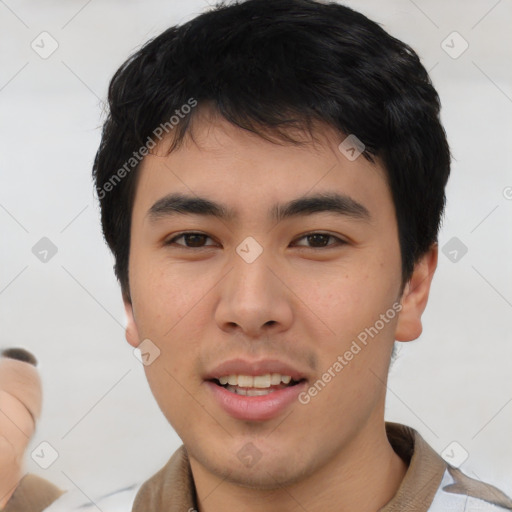 Joyful asian young-adult male with short  black hair and brown eyes