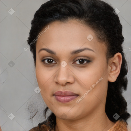 Joyful black young-adult female with long  brown hair and brown eyes