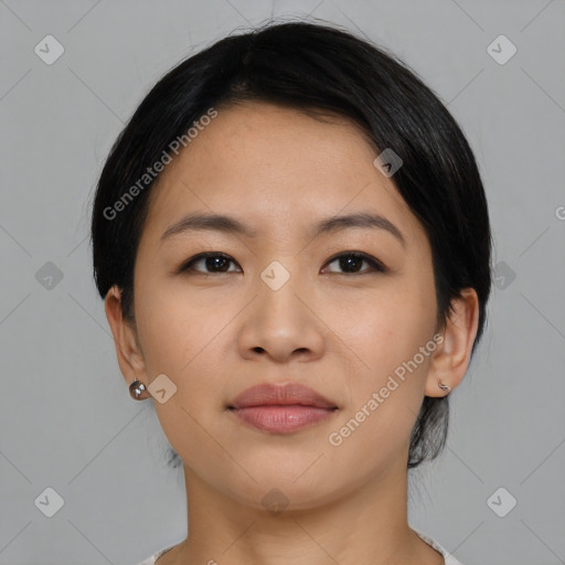 Joyful asian young-adult female with medium  black hair and brown eyes