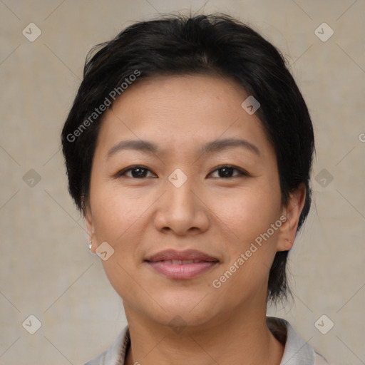 Joyful asian young-adult female with medium  brown hair and brown eyes