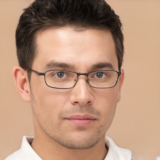 Joyful white young-adult male with short  brown hair and brown eyes