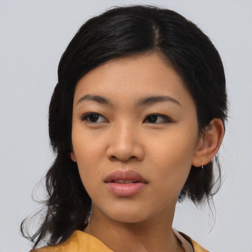 Joyful asian young-adult female with medium  black hair and brown eyes
