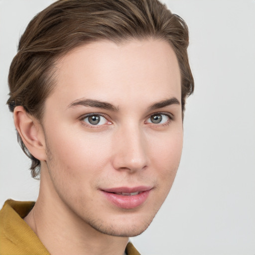 Joyful white young-adult female with short  brown hair and grey eyes