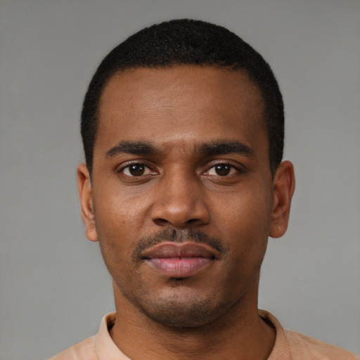 Neutral black young-adult male with short  black hair and brown eyes