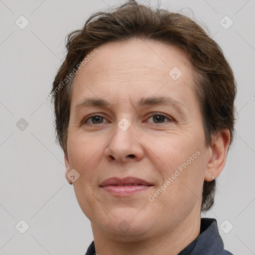 Joyful white adult female with short  brown hair and brown eyes