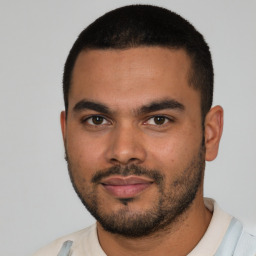 Neutral latino young-adult male with short  black hair and brown eyes