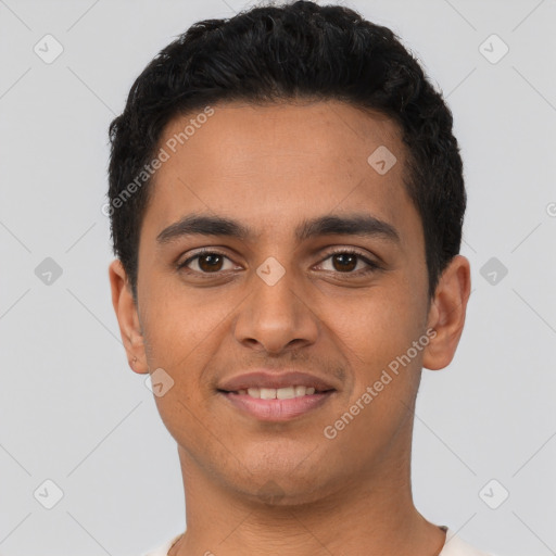 Joyful latino young-adult male with short  black hair and brown eyes