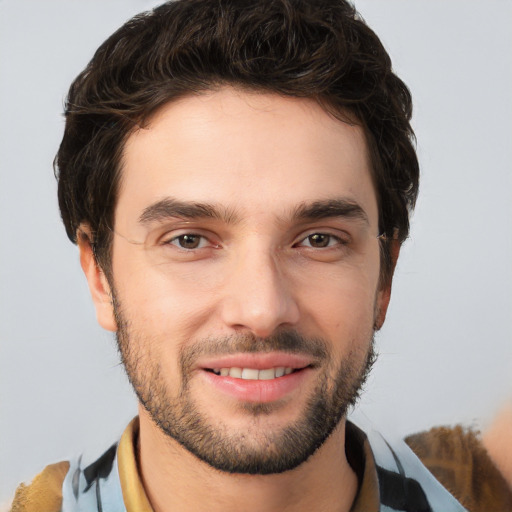 Joyful white young-adult male with short  brown hair and brown eyes