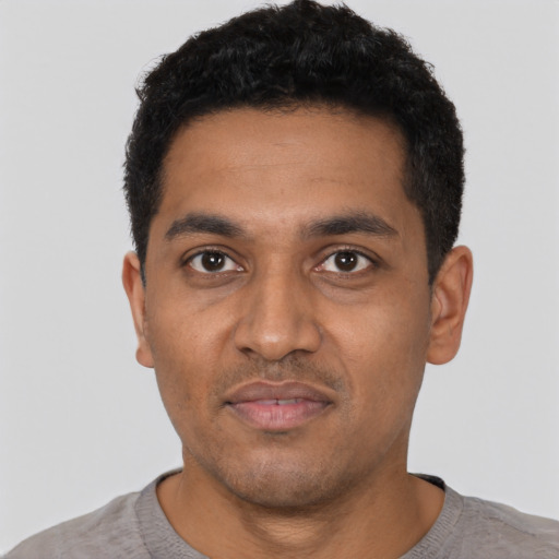 Neutral black young-adult male with short  black hair and brown eyes