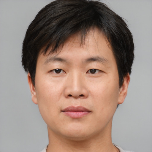 Neutral asian young-adult male with short  brown hair and brown eyes