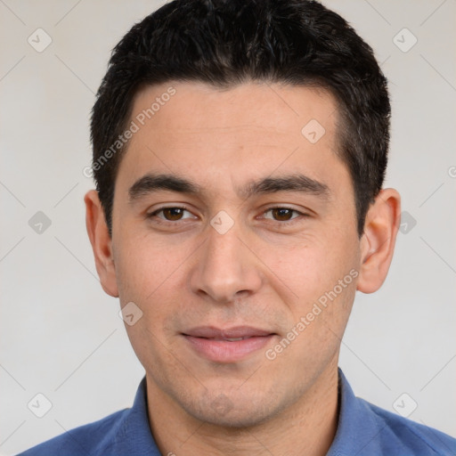 Joyful white young-adult male with short  black hair and brown eyes