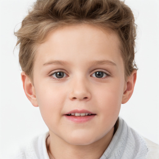 Joyful white child male with short  brown hair and blue eyes