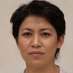 Joyful asian adult female with short  brown hair and brown eyes