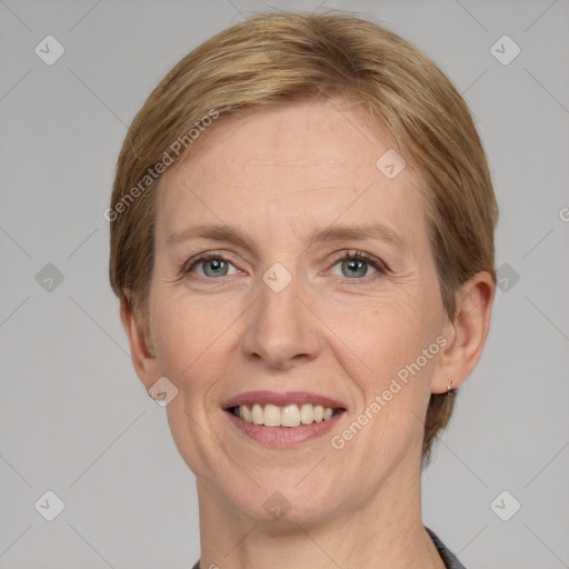 Joyful white adult female with short  brown hair and grey eyes