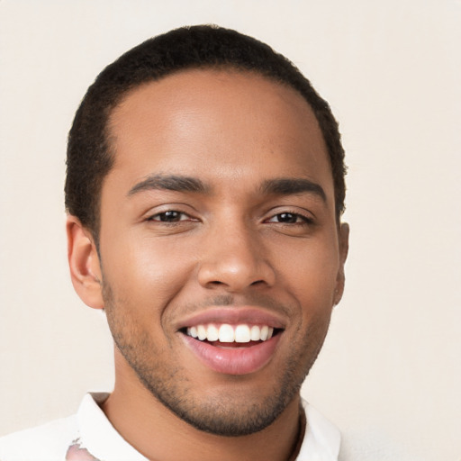 Joyful latino young-adult male with short  brown hair and brown eyes