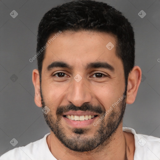 Joyful latino young-adult male with short  black hair and brown eyes