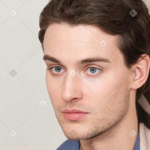 Neutral white young-adult male with short  brown hair and grey eyes