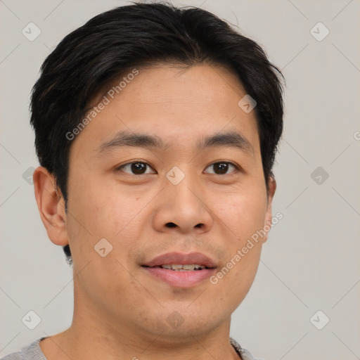 Joyful asian young-adult male with short  brown hair and brown eyes