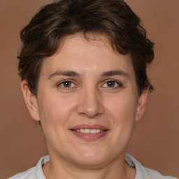 Joyful white adult female with short  brown hair and brown eyes