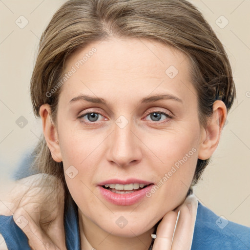 Joyful white young-adult female with medium  brown hair and blue eyes