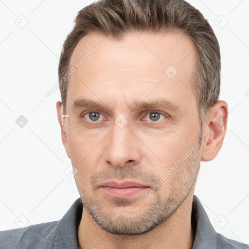 Neutral white adult male with short  brown hair and brown eyes