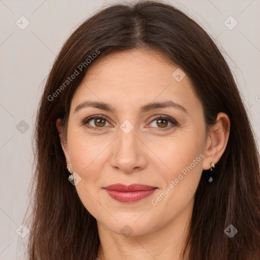 Joyful white adult female with long  brown hair and brown eyes