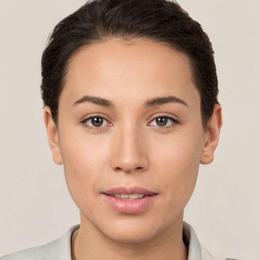 Joyful white young-adult female with short  brown hair and brown eyes