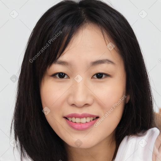 Joyful asian young-adult female with long  brown hair and brown eyes