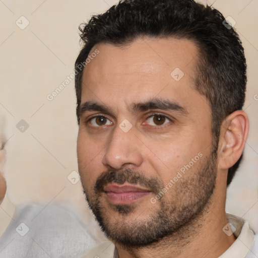 Neutral white young-adult male with short  black hair and brown eyes