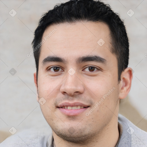 Joyful latino young-adult male with short  black hair and brown eyes