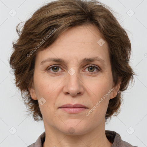 Joyful white adult female with medium  brown hair and grey eyes