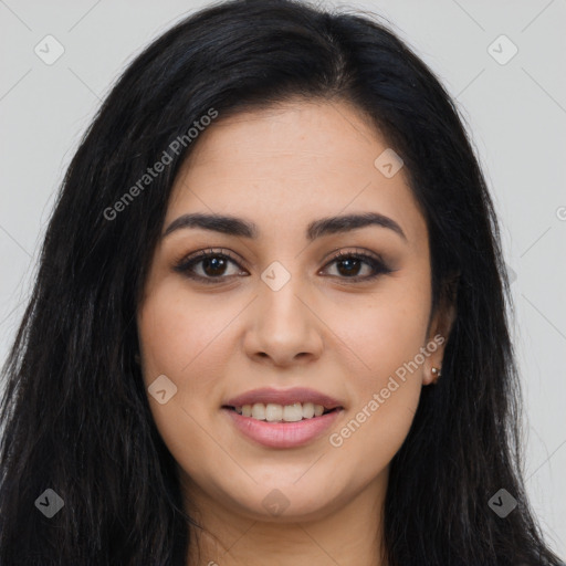 Joyful latino young-adult female with long  brown hair and brown eyes