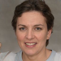 Joyful white adult female with short  brown hair and brown eyes