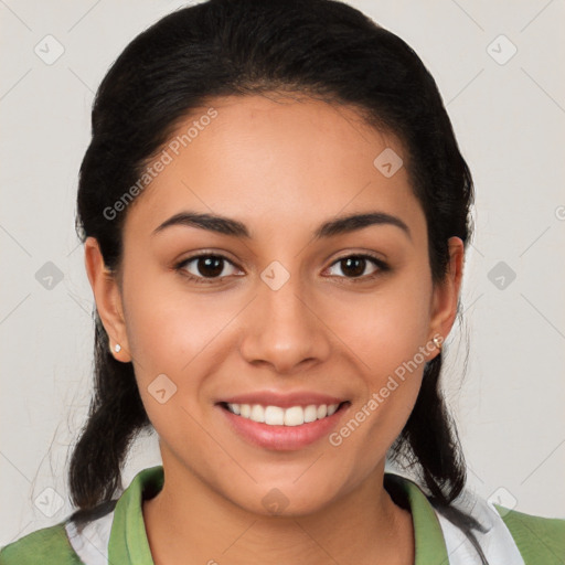 Joyful latino young-adult female with medium  brown hair and brown eyes