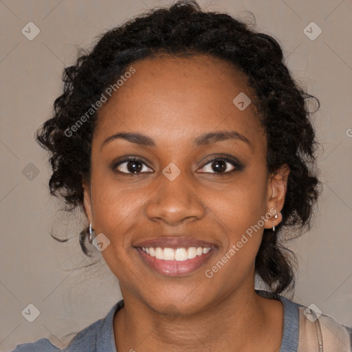 Joyful black young-adult female with medium  black hair and brown eyes