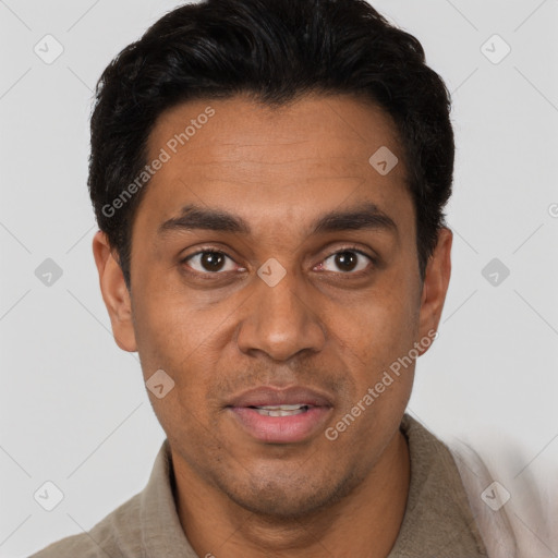 Joyful latino adult male with short  black hair and brown eyes