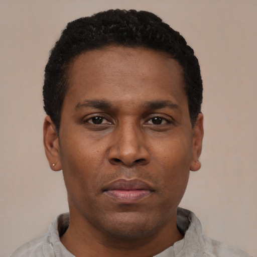 Neutral black young-adult male with short  black hair and brown eyes