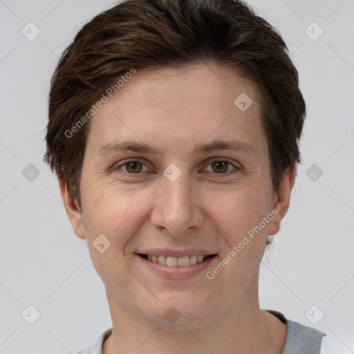 Joyful white adult female with short  brown hair and grey eyes