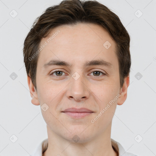 Joyful white young-adult male with short  brown hair and brown eyes