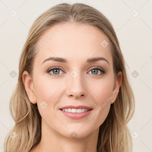 Joyful white young-adult female with long  brown hair and blue eyes